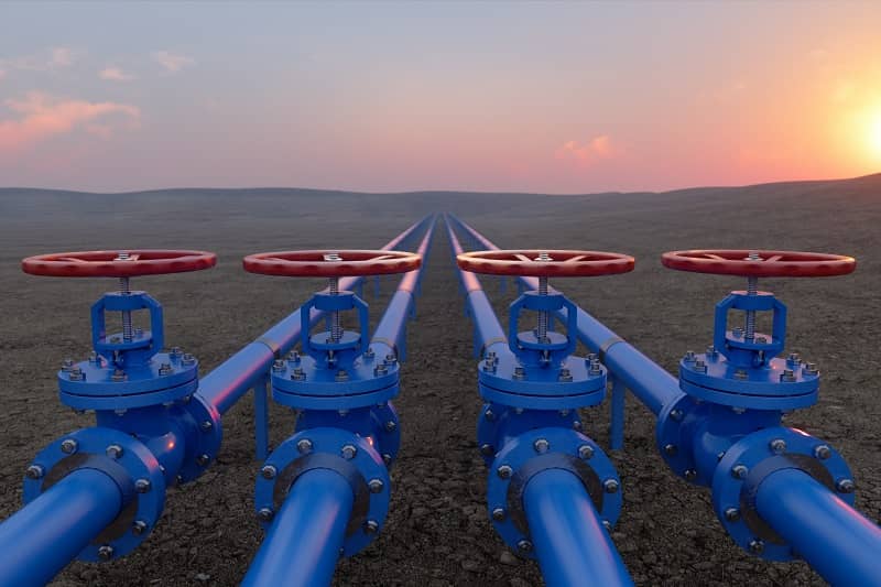 Oil Or Gas Transportation With Blue Gas Or Pipe Line Valves On Soil And Sunrise Background -cm
